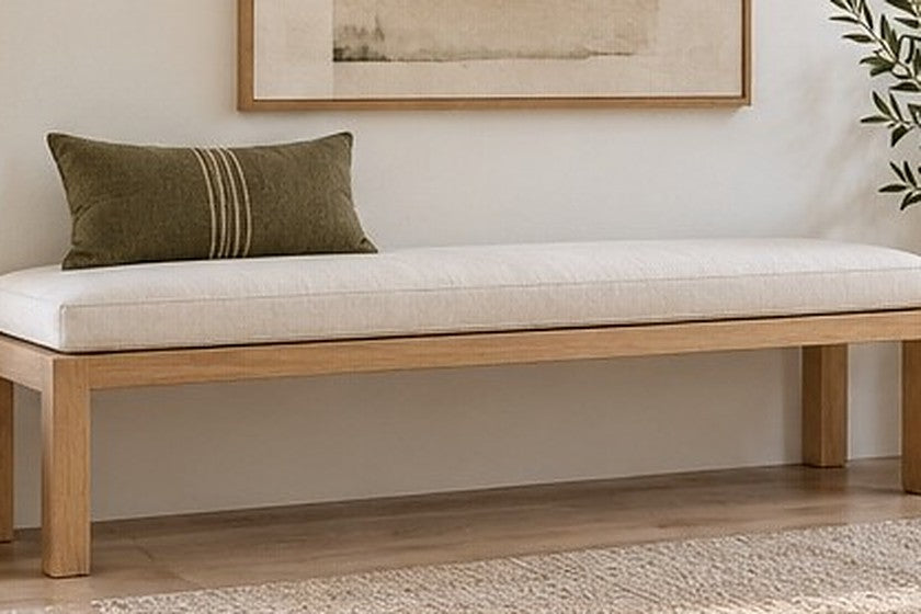 Light oak bench with a removable ivory seat cushion