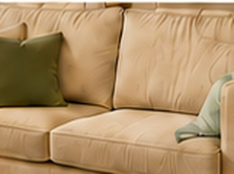 Love2Stick grip pad used under a sofa seat cushion
