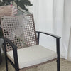 Placing a Love2Stick pad on a chair seat beneath its removable cushion, a captioned demonstration of tipping this particular chair (results vary by material), then lifting the cushion off